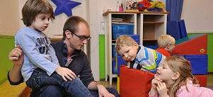Children and their caretaker (Photo: Dorn) Children and their caretaker