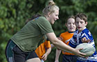 Rugby trainer and children (Photo: Anspach)